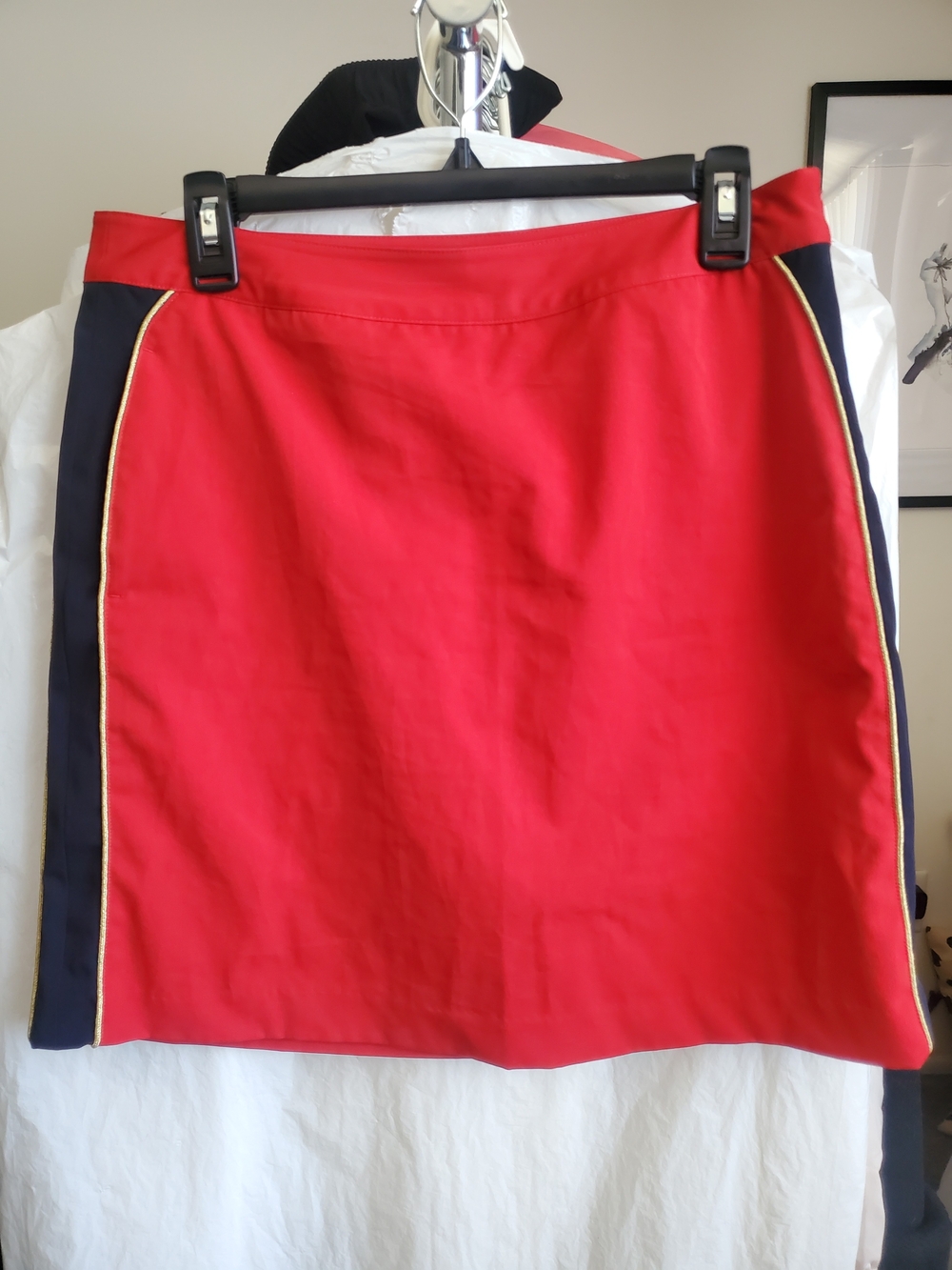 Classic Red Golf Skirt with Navy Side Panels and Gold Trim
